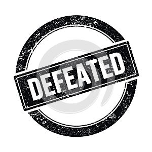 DEFEATED text on black grungy round stamp