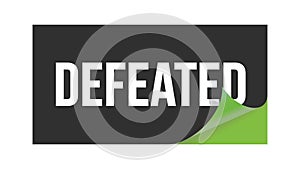 DEFEATED text written on black green sticker