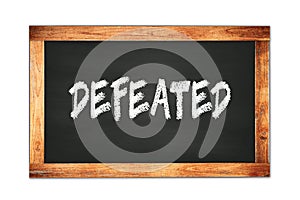 DEFEATED text written on wooden frame school blackboard