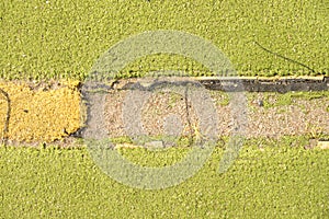 Defects in playground. Damaged lines in outdoor handball court.