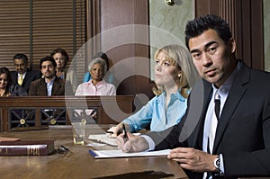 Defense Lawyer With Client In Court photo