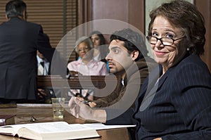 Defense Lawyer With Client In Court