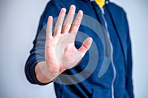 Defense or stop gesture: Male hand with stop gesture