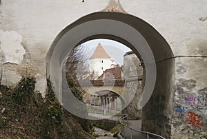 A defense tower seen through one of the arched gates of the Graft Bastion, Romania, Brasov Bastionul Graft 1515- 1