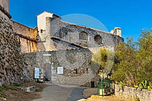 Defense walls and towers of medieval fortress Fort Carre castle in Antibes resort city onshore Mediterranean Sea in France