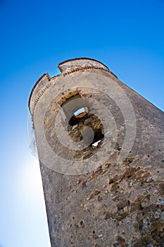 Defensive tower with sun behind photo