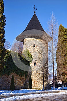 Defensive tower and walls at a medieval monastery photo