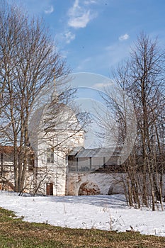 The defensive wall of an ancient fortress. White stone wall of the Pereslavl-Zalessky monastery