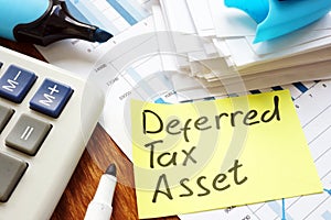 Deferred tax asset written sign and calculator.