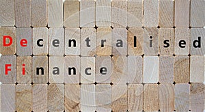 DeFi, Decentralised finance symbol. Concept words `DeFi, Decentralised finance` on wooden blocks. Beautiful wooden background,