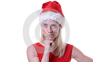 Defiant irate woman in a festive red Santa Hat