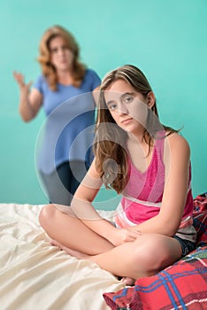 Defiant teenage girl ignoring her mother