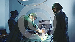 Defibrillation cardiac dysrhythmia, Surgical doctor team performing surgery patient on operating room in hospital