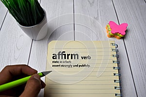 Definition of Affirm word with a meaning on a book. dictionary concept