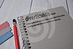 Definition of Diverticulitis word with a meaning on a book. dictionary concept photo