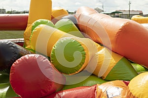 Deflate obstacle course in amusement park. Air escapes from inflatable structure. Details of collection of attractions