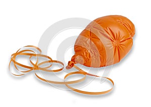 Deflated orange ballon and ribbon