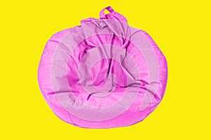 Deflated Pink Bean Bag Isolated on Yellow Background