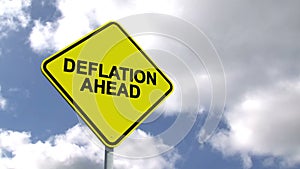 Deflation ahead sign against blue sky