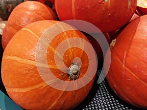 Defocud image of close up mini pumpkins in farmer& x27;s market. Halloween, October, November.