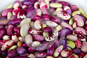 Defocus purple beans background. Background of many grains of dried beans. Brown beans texture. Food background