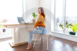 Defocus. Young business woman is meditating after work the Internet using a computer