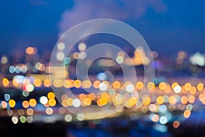 Defocused abstract image. Bokeh effect. Golden lights of the big city. Night city landscape, lights and Windows of houses