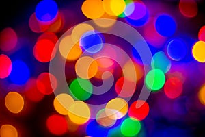 Defocused abstract multicolored bokeh lights background. Blue, purple, green, orange colors. - christmas and new year concept