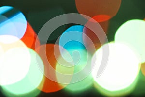 Defocused abstract multicolored bokeh lights background. Orange, yellow, red colors.