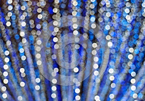 Defocused blue and white small christmas lights bokeh