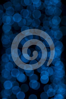 Defocused of blurred blue bokeh circle light from lighting bulb in the night for abstract background texture