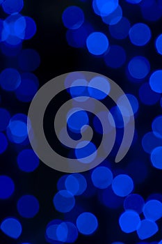 Defocused of blurred phantom blue bokeh circle light from lighting bulb in the night for abstract background texture