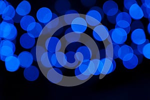 Defocused of blurred phantom blue bokeh circle light from lighting bulb in the night for abstract background texture