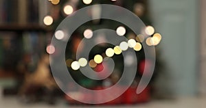 Defocused christmas fairy lights. Out of focus holiday background christmas tree with red santa train