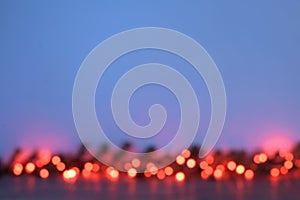 Defocused Christmas garland of red lights on a blue background