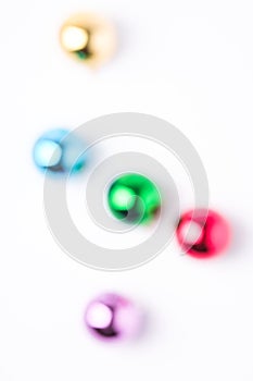 Defocused Christmas New Year composition. Gifts, colorful ball decorations on white background