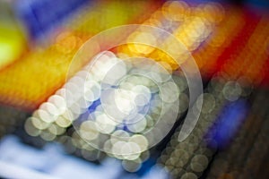 Defocused colorful bokeh lights in black abstract for background