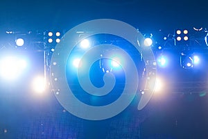 Defocused entertainment concert lighting on stage, bokeh.