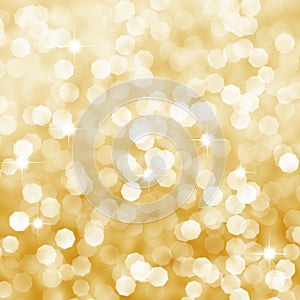 Defocused golden bokeh background with sparkles