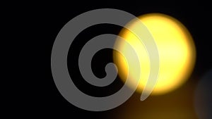 Defocused golden circles light effects, abstract blurred motion boche particles