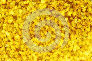 Defocused golden glitter bokeh with close up view photo