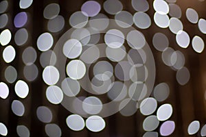 Defocused grey abstract bokeh lights background. Blurred