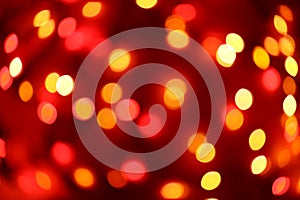 Defocused lights abstract red and yellow christmas background bokeh