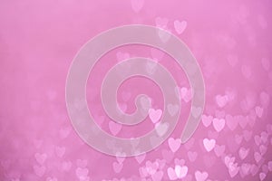 Defocused lights bokeh background of pink hearts