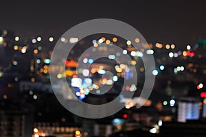 Defocused lights and building in night time