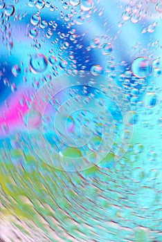 Defocused multicolored abstract background picture made with oil, water and soap with mooving boubbles