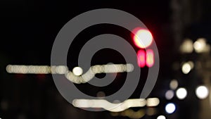 Defocused night Traffic red Lights countdown to green in city streets at night