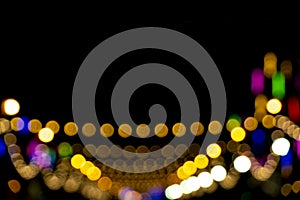 Defocused of photo bokeh blurred circle light from colorful neon lighting bulb in the night for abstract background