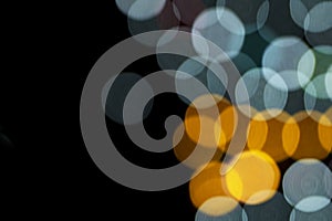 Defocused of photo bokeh blurred circle light from colorful neon lighting bulb in the night for abstract background