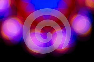 Defocused of photo bokeh blurred circle light from colorful neon lighting bulb in the night for abstract background